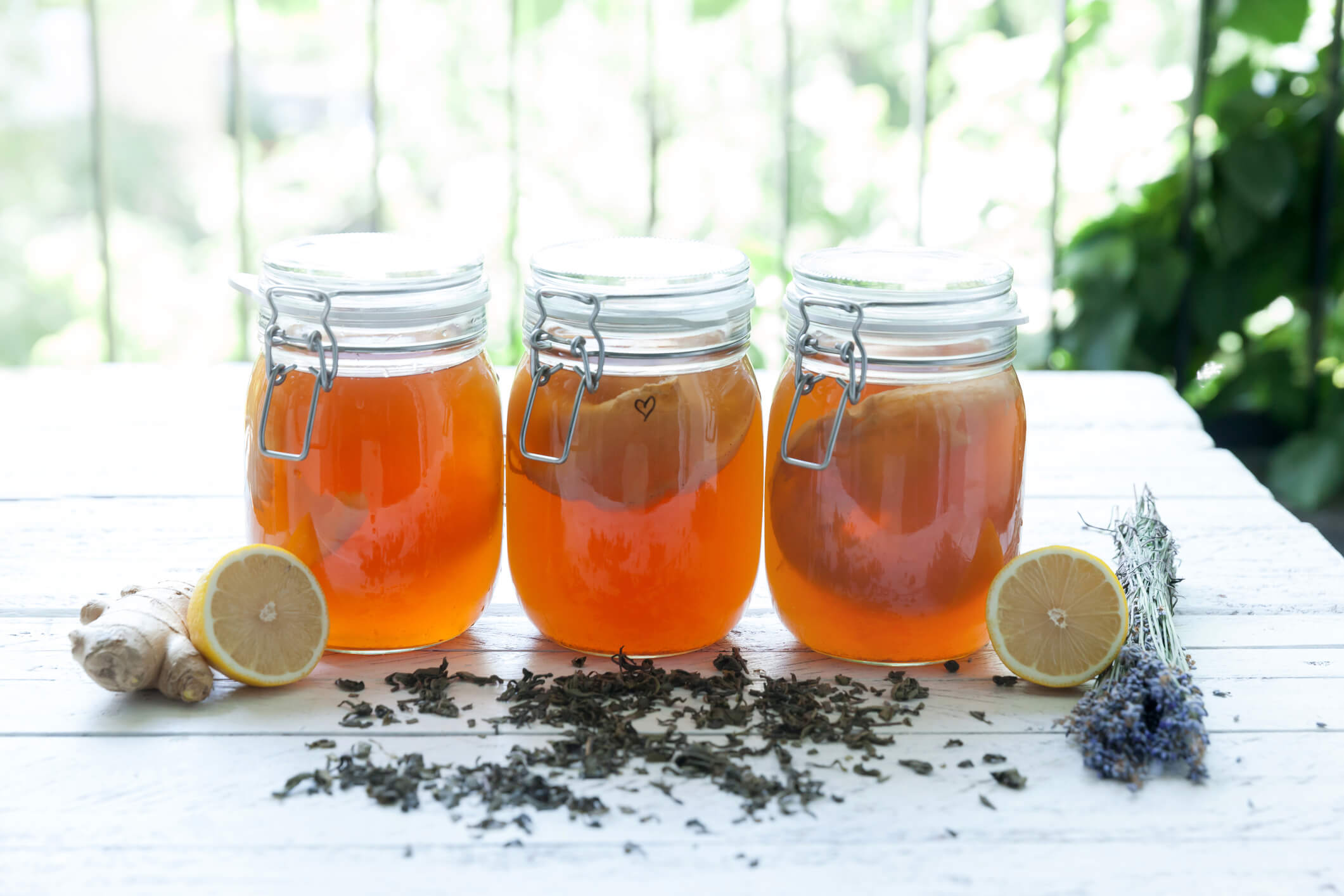 kombucha tea in a mason jar sitting on a table
