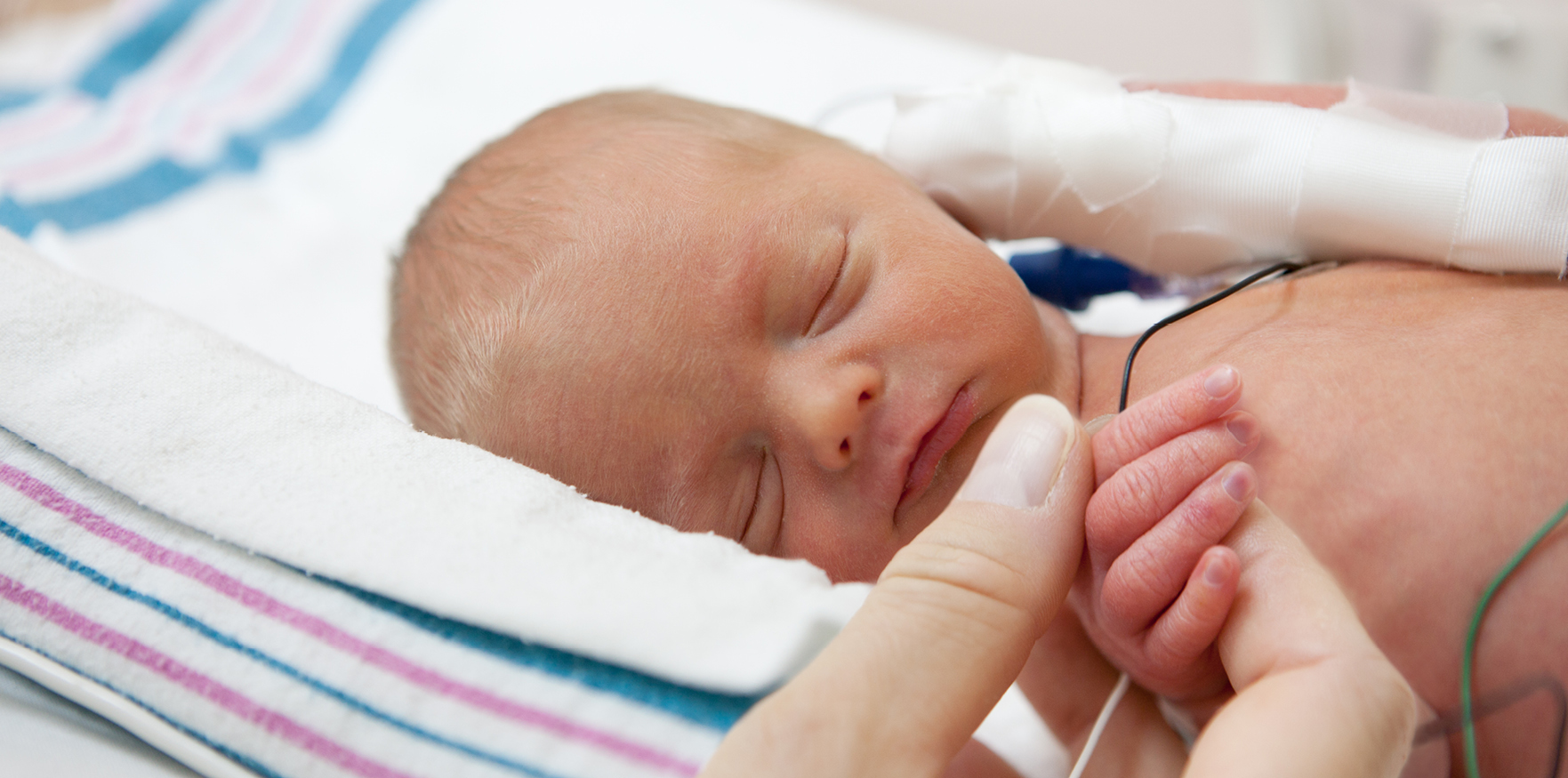 photo of sleeping preemie baby