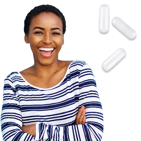 Women smiling with arms crossed in foreground with three pill capsules in background